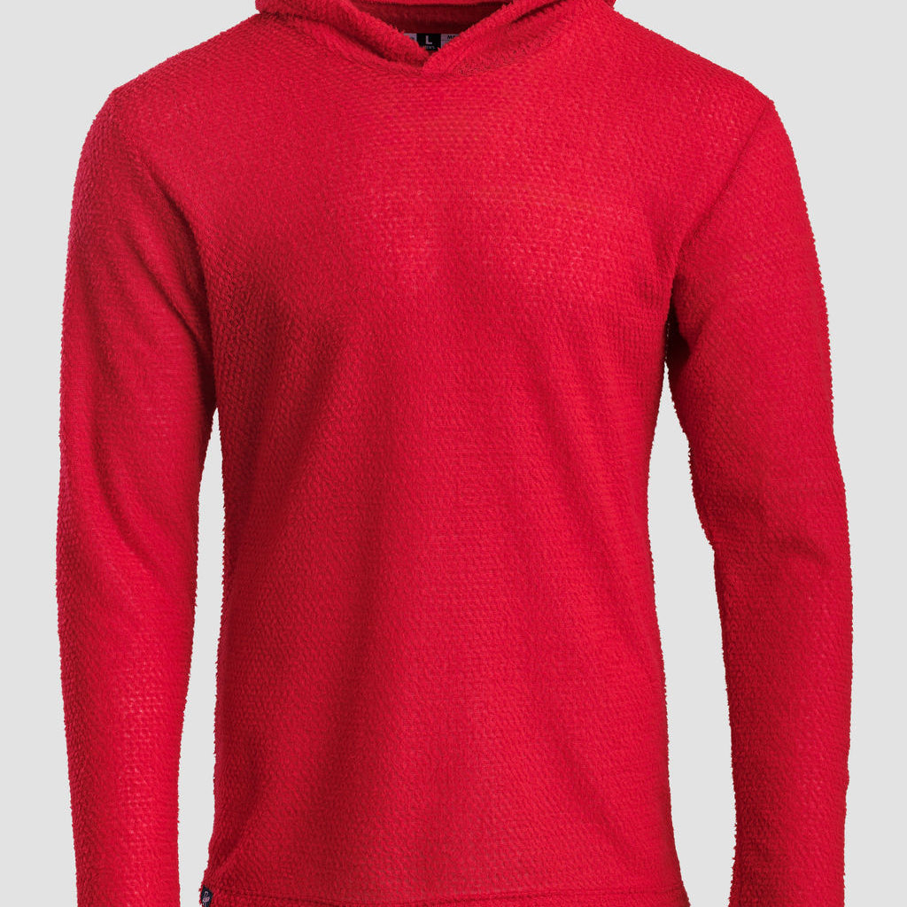 A bright orange Alpha 60 hoodie shown on a neutral light gray background.