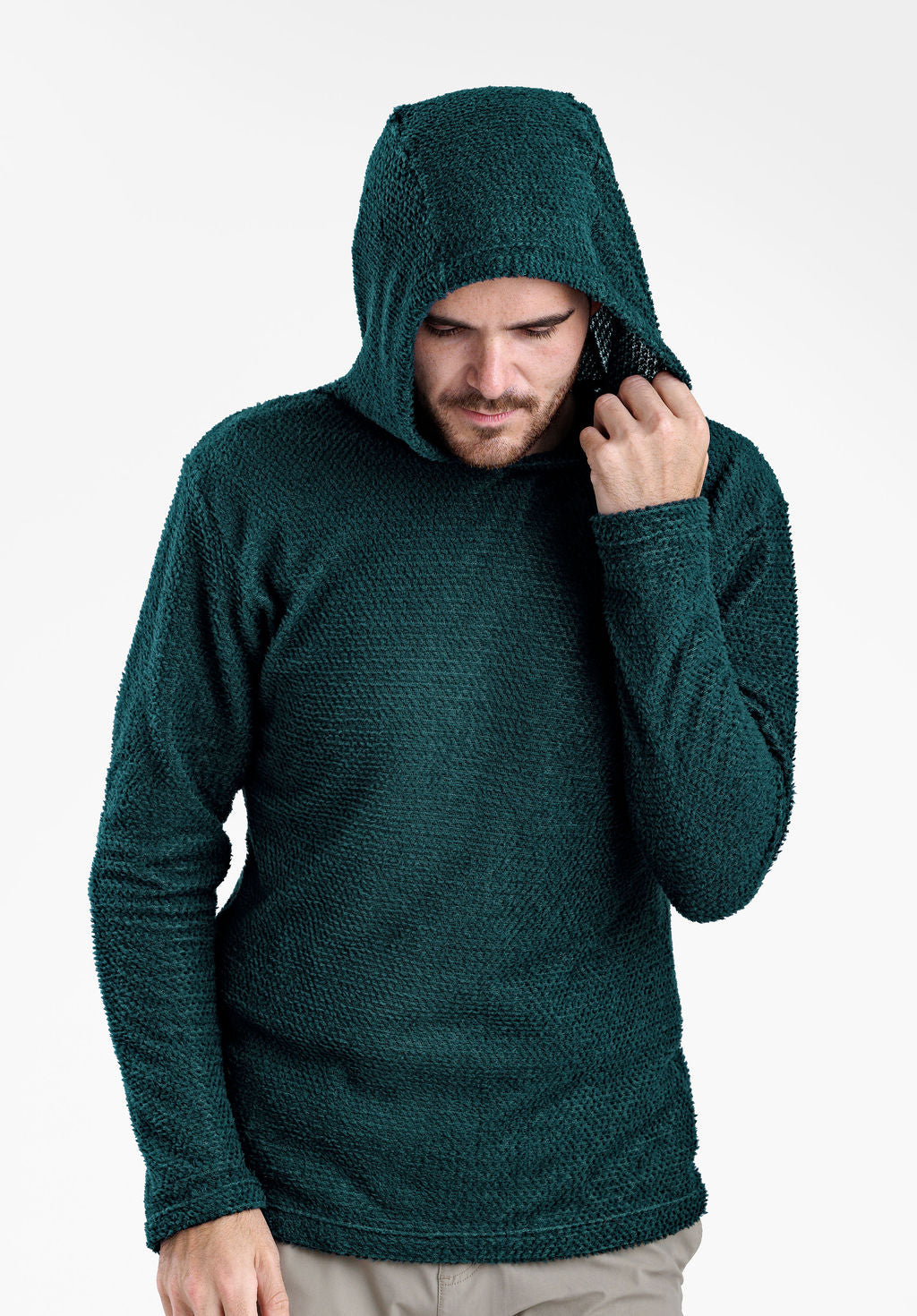 A man wearing a dark green textured Alpha 90 hoodie, posing with the hood up against a plain white background.