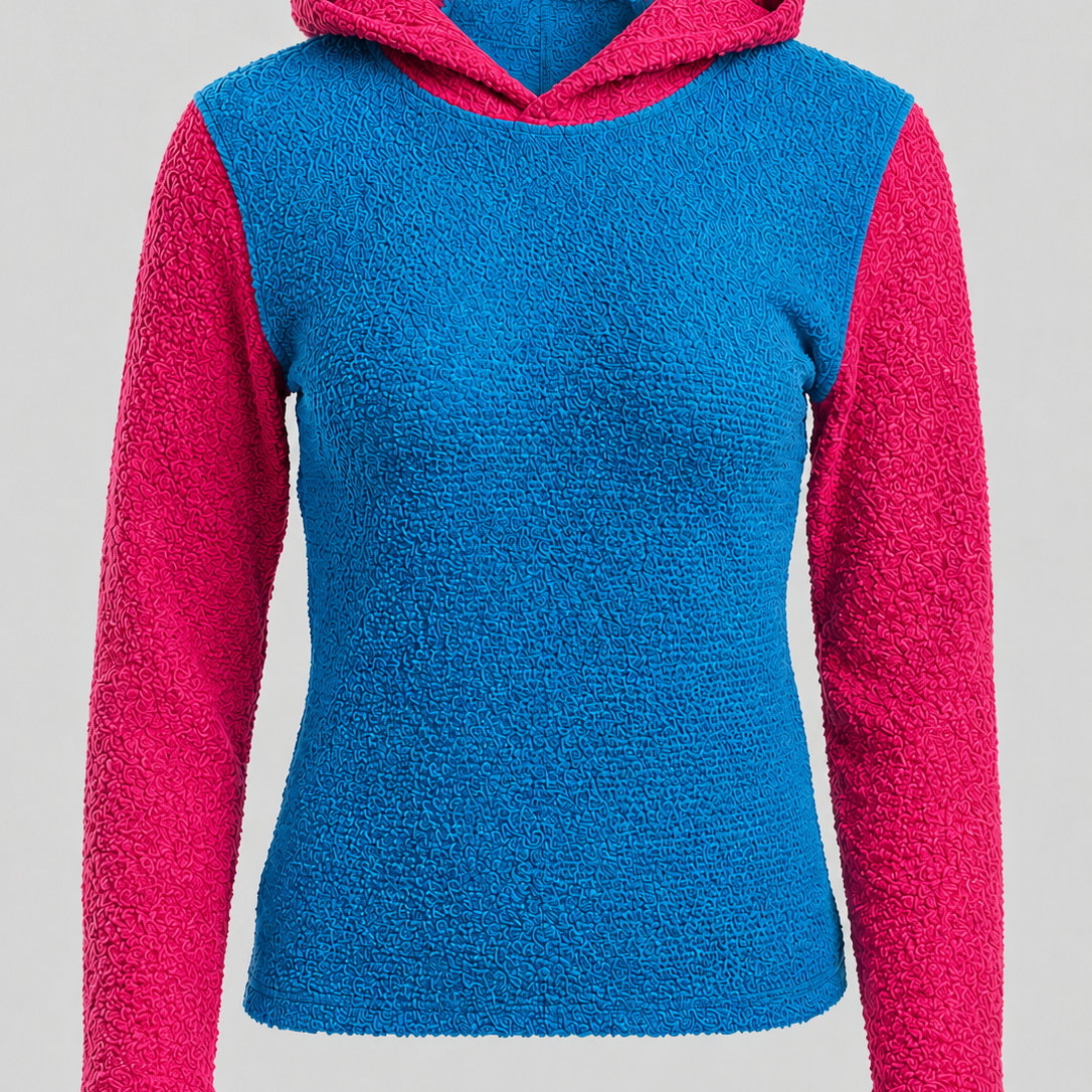 A women's sherpa fleece hooded sweater with a bright blue body and contrasting hot pink sleeves and hood lining, shown against a neutral light gray background.
