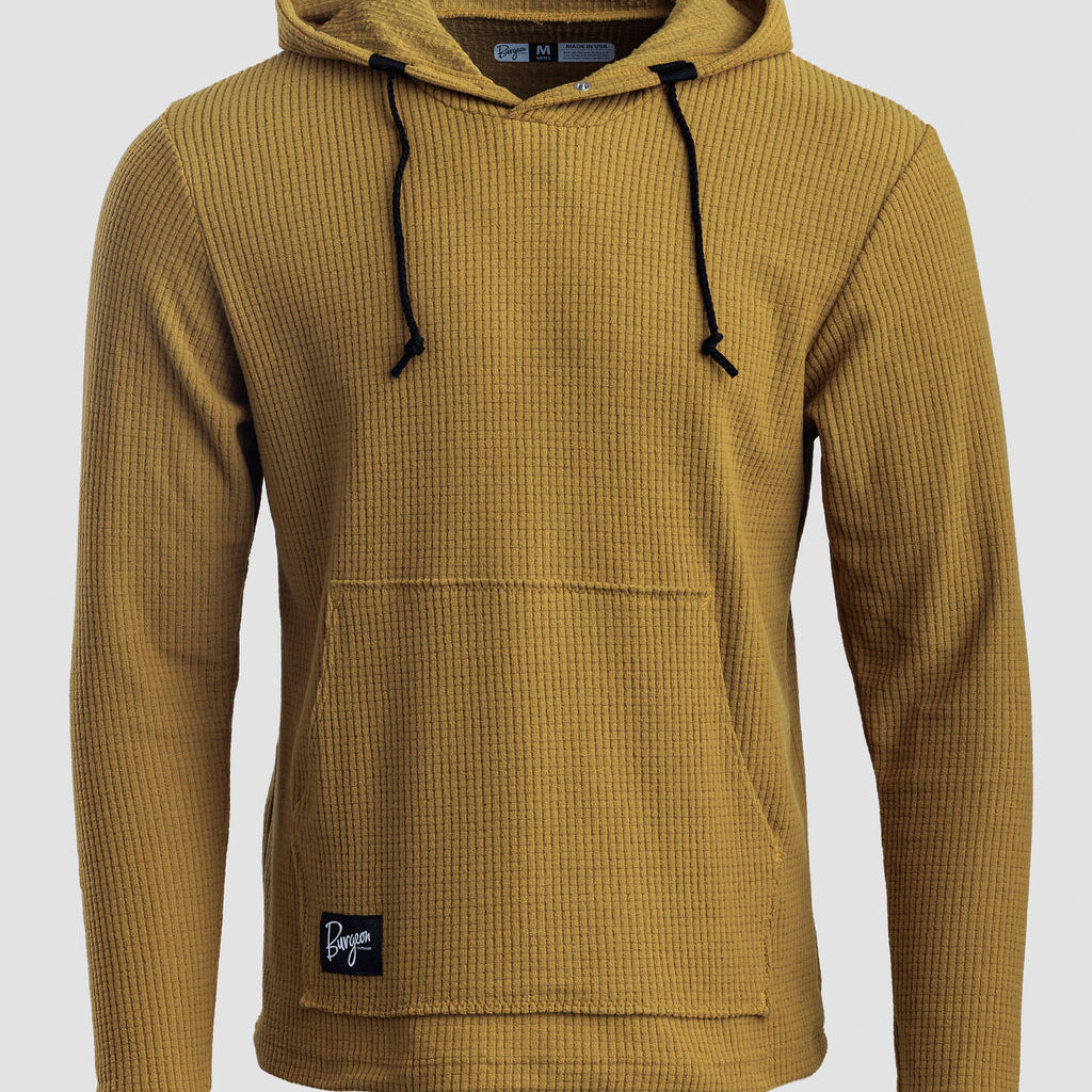A mustard yellow Highlander hoodie with black drawstrings and a front kangaroo pocket, shown on a light gray background.