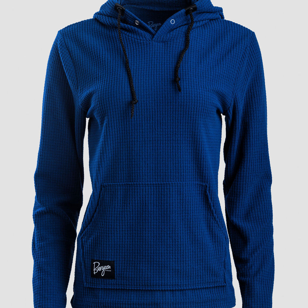 A royal blue Highlander Hoodie with black drawstrings and a black brand patch on the lower left front, displayed on a light gray background.