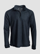 A dark navy blue quarter-zip Polartec Alpha Direct Hoodie on a neutral light gray background.