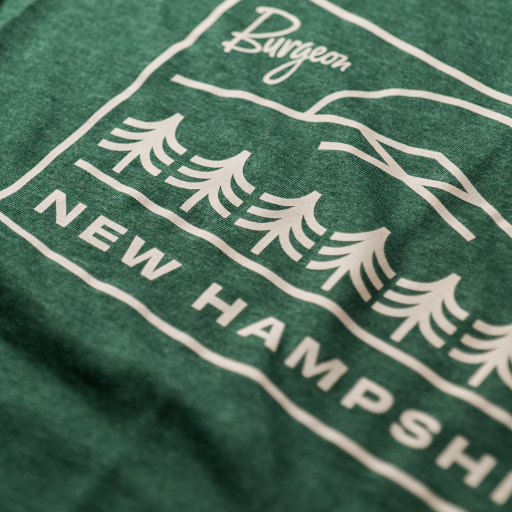 Closeup of NH Treeline T-Shirt in Pine Green.