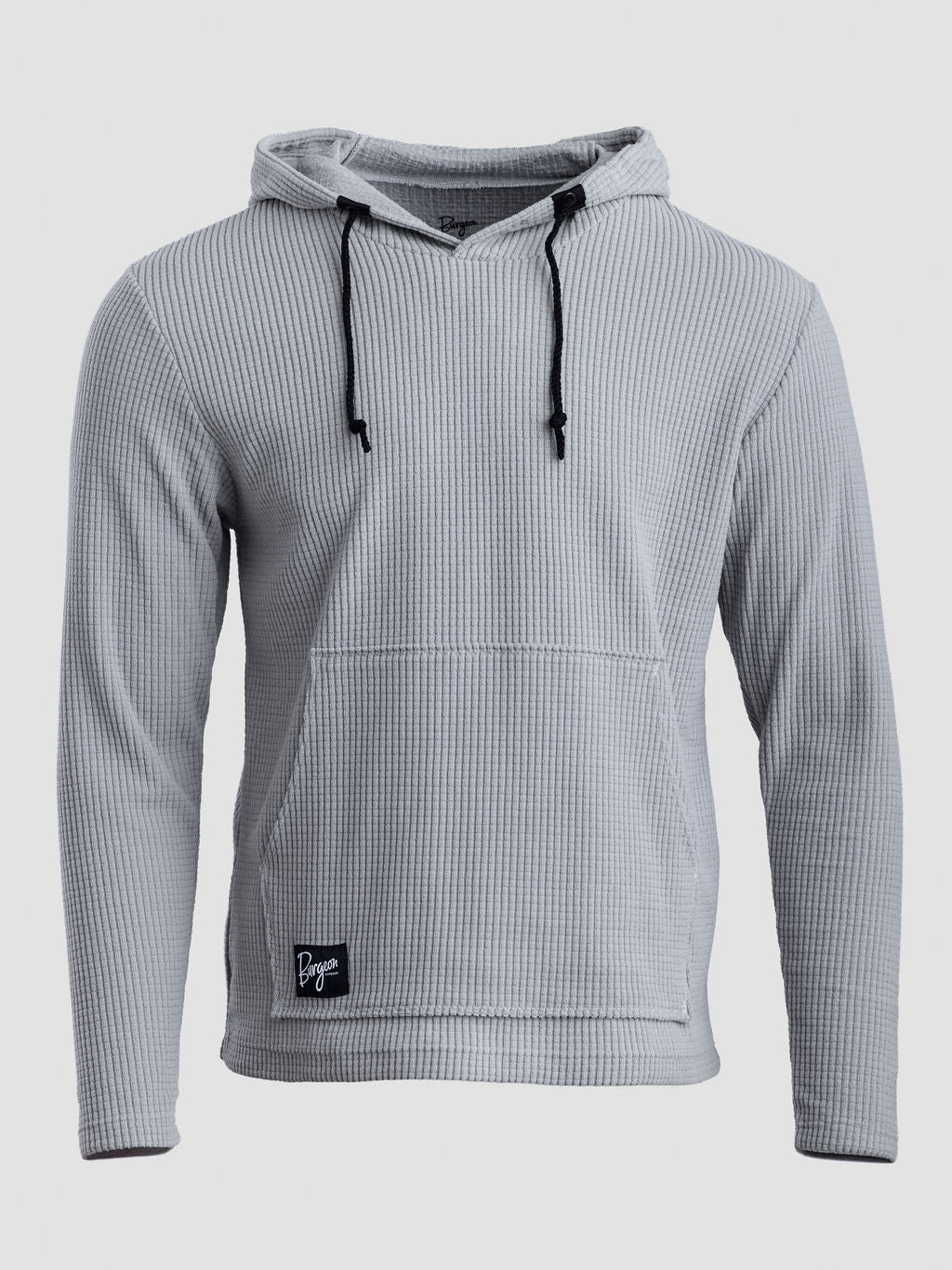 A light gray Highlander hoodie with black drawstrings and a small black brand patch on the lower front pocket, shown against a light gray background.