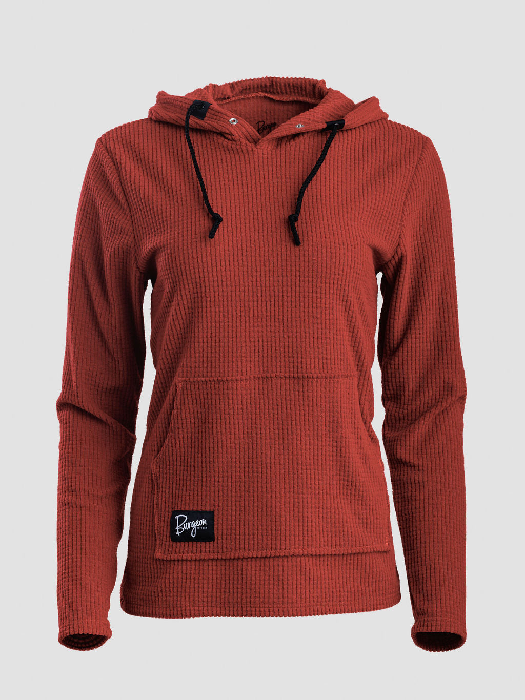 A rust-colored Highlander hoodie with black drawstrings and a small black brand patch on the front pocket, shown against a light gray background.