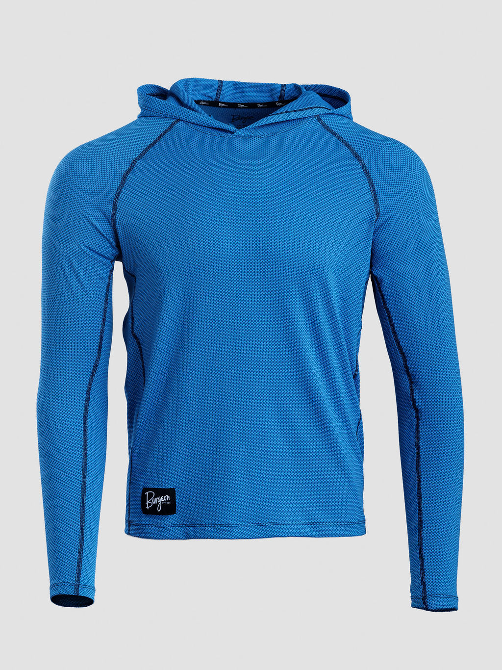 A bright blue long-sleeve Sunseeker Hoodie with black contrast stitching and a small black logo patch on the bottom left, displayed on a neutral light gray background.