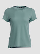 A women's short-sleeve crewneck t-shirt in a muted sage green color, shown against a plain light gray background.