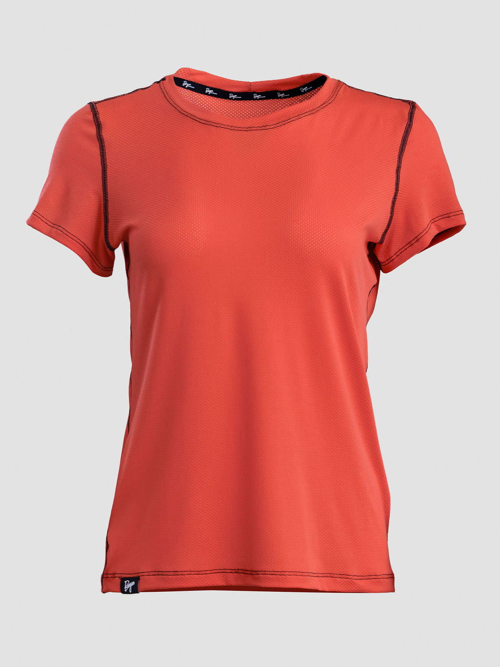 A women's short-sleeve athletic t-shirt in a vibrant orange-red color, featuring black contrast stitching along the shoulders and neckline, displayed against a solid light gray background.