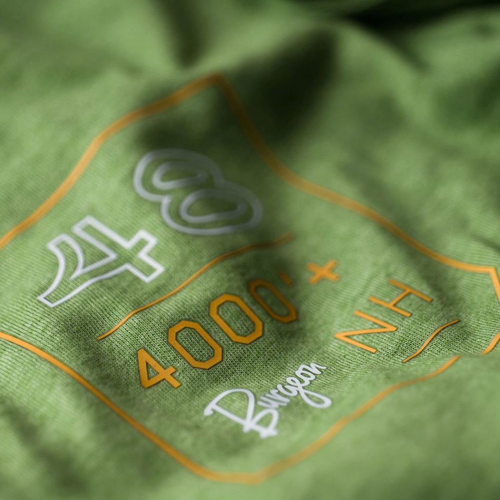 Close up of the front of shirt logo on the 4,000 Footers T-Shir