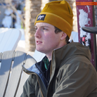Power Stretch Fleece Hat in Autumn Gold on a skier.